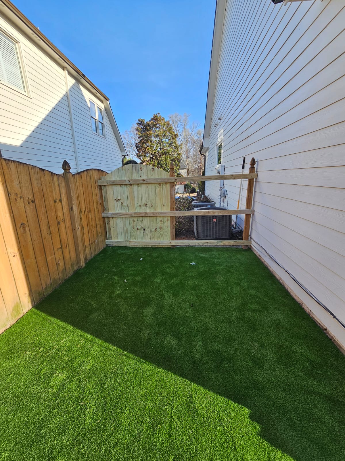 Artificial turf installation on slope in Canton GA by Kaizenscapes