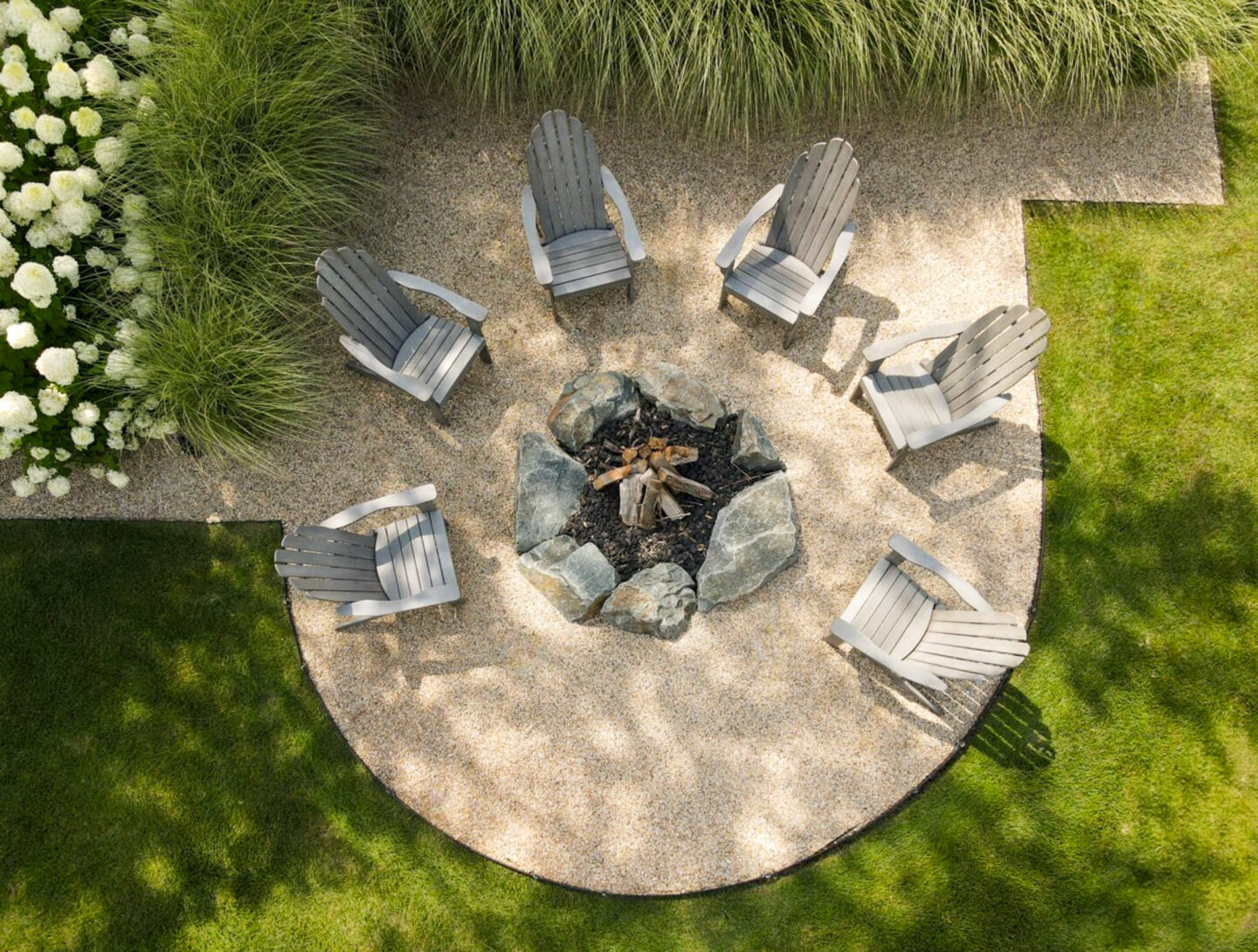 Custom outdoor fire pit with seating wall in Cherokee County Georgia