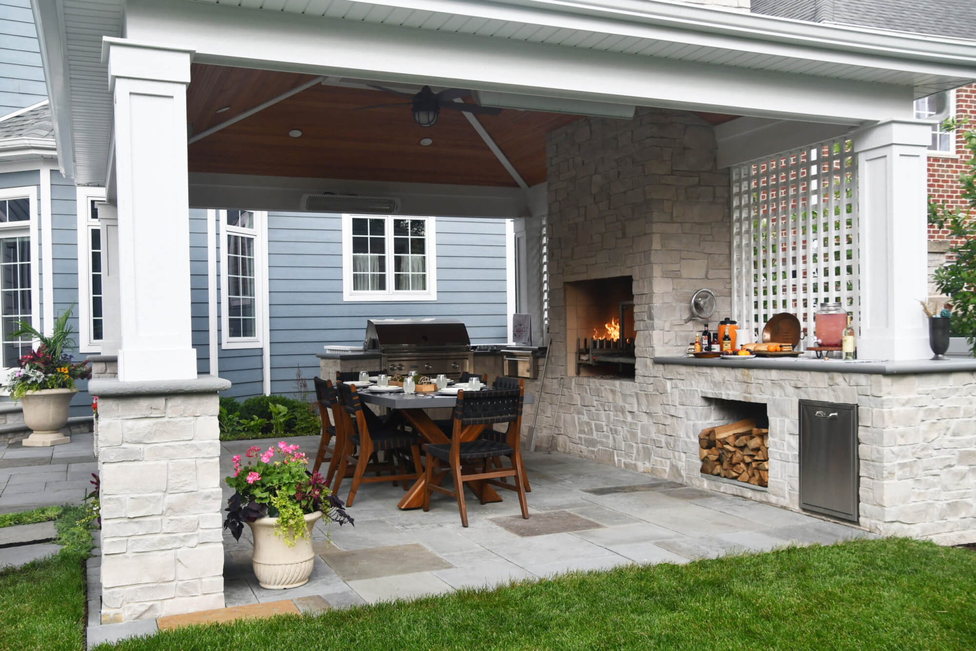 Integrated outdoor kitchen and patio design by Kaizenscapes in Canton Georgia