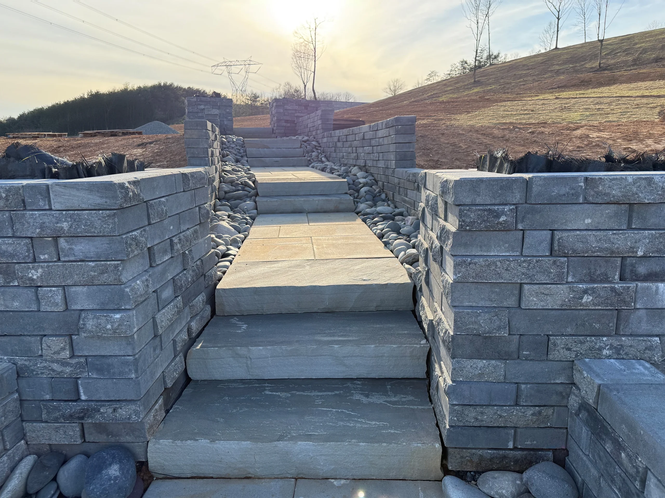Completed custom stonework retaining wall and staircase project in Canton Georgia