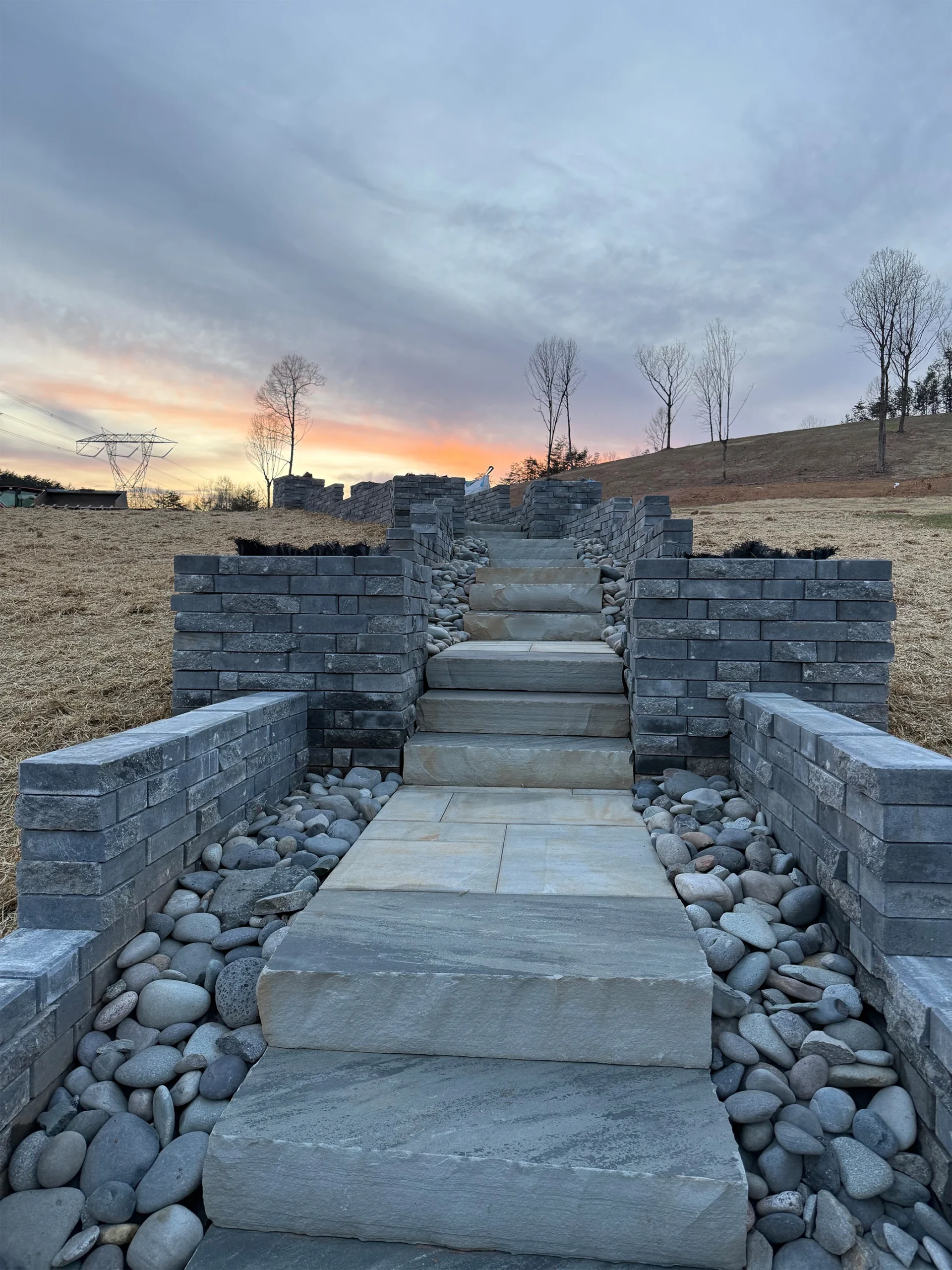 Why Natural Stone Retaining Walls in Roswell Outlast Block — What the Difference Actually Looks Like