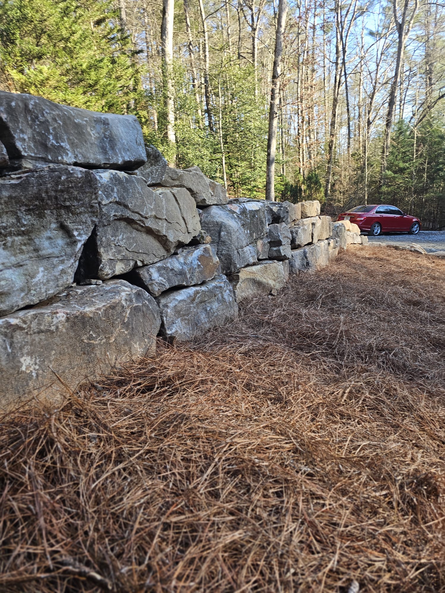 Natural stone retaining wall built by Kaizenscapes in Cherokee County GA
