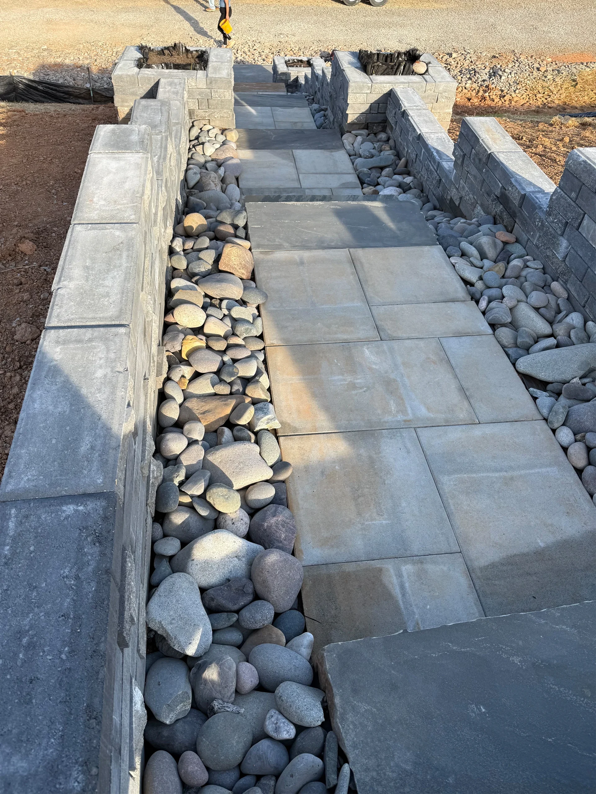 How Kennesaw Homeowners Are Reclaiming Sloped Backyards With Engineered Retaining Systems