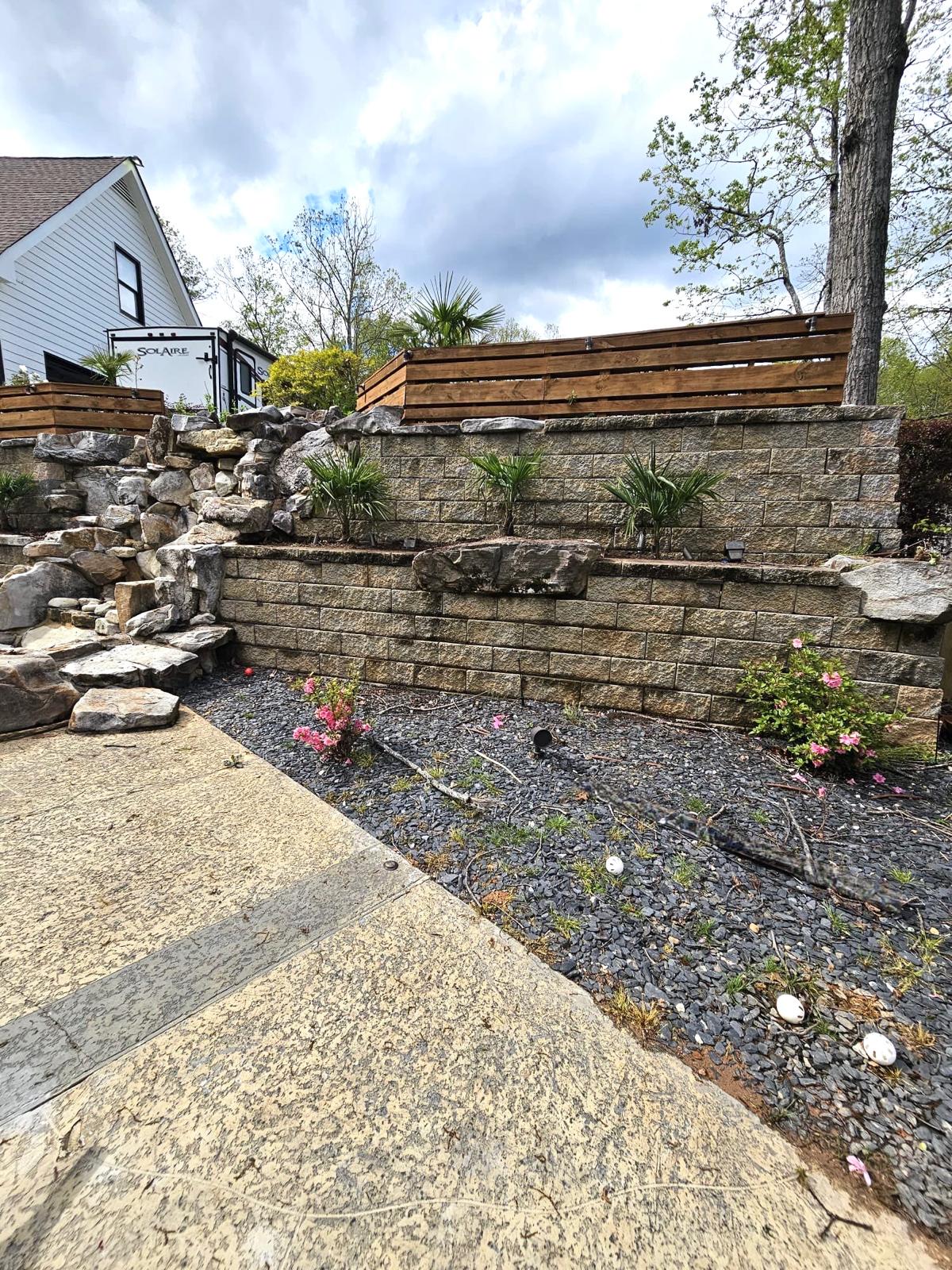 Stone retaining wall with landscaping in Cherokee County Georgia