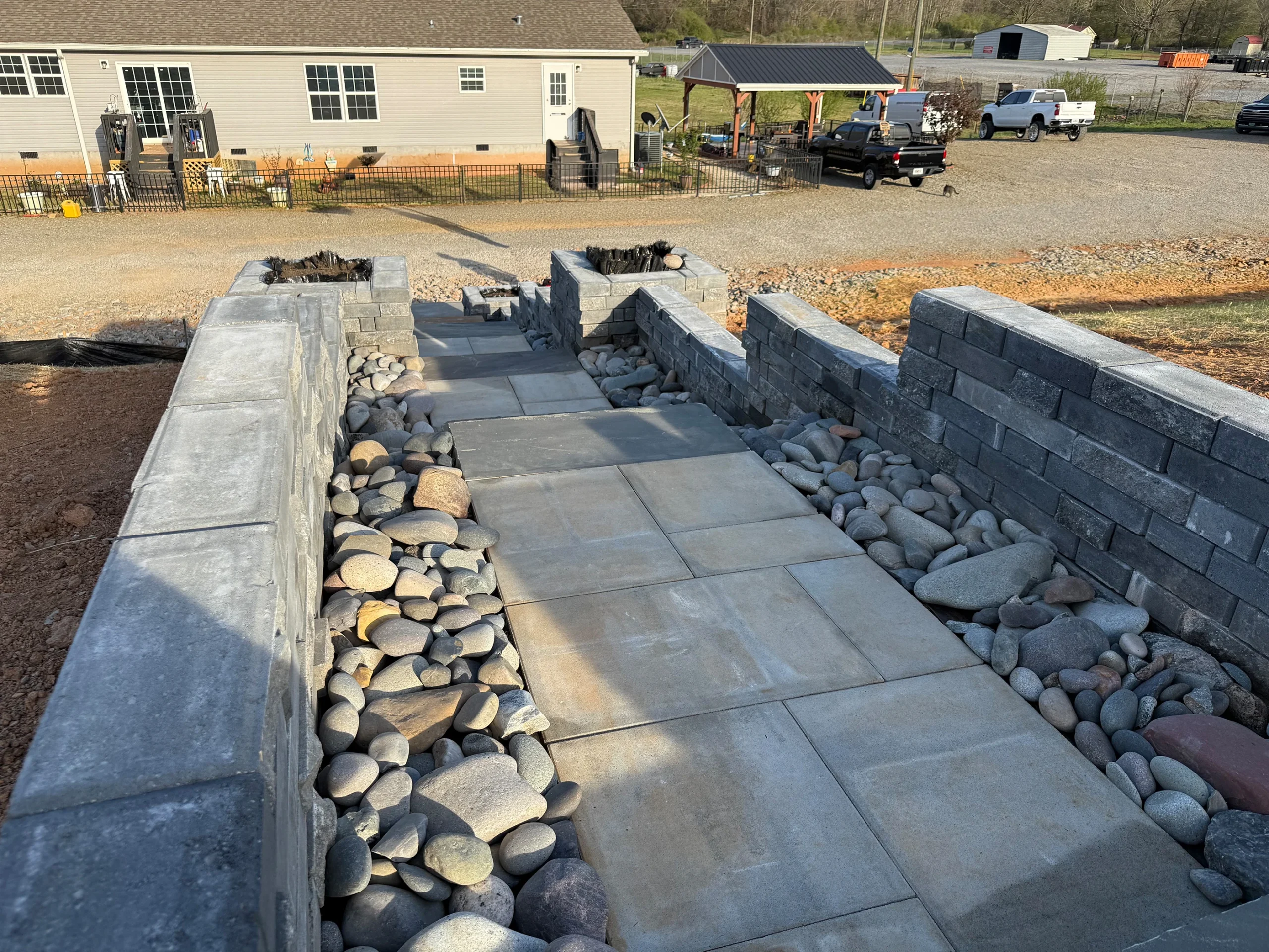 How Holly Springs Homeowners Are Solving Grade Problems With Tiered Retaining Walls