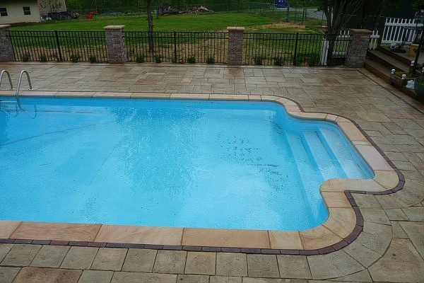 Why Marietta Homeowners Are Replacing Concrete Pool Decks With Pavers — And What the Upgrade Actually Delivers