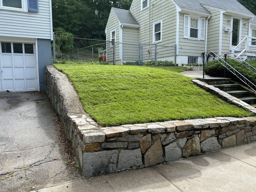 What a Retaining Wall in Woodstock GA Actually Costs — And What the Low Bids Are Leaving Out