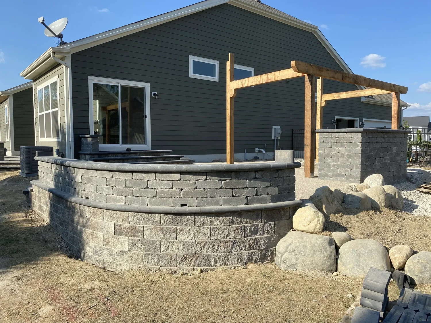 Stone walkway and landscape lighting installation in an Alpharetta backyard