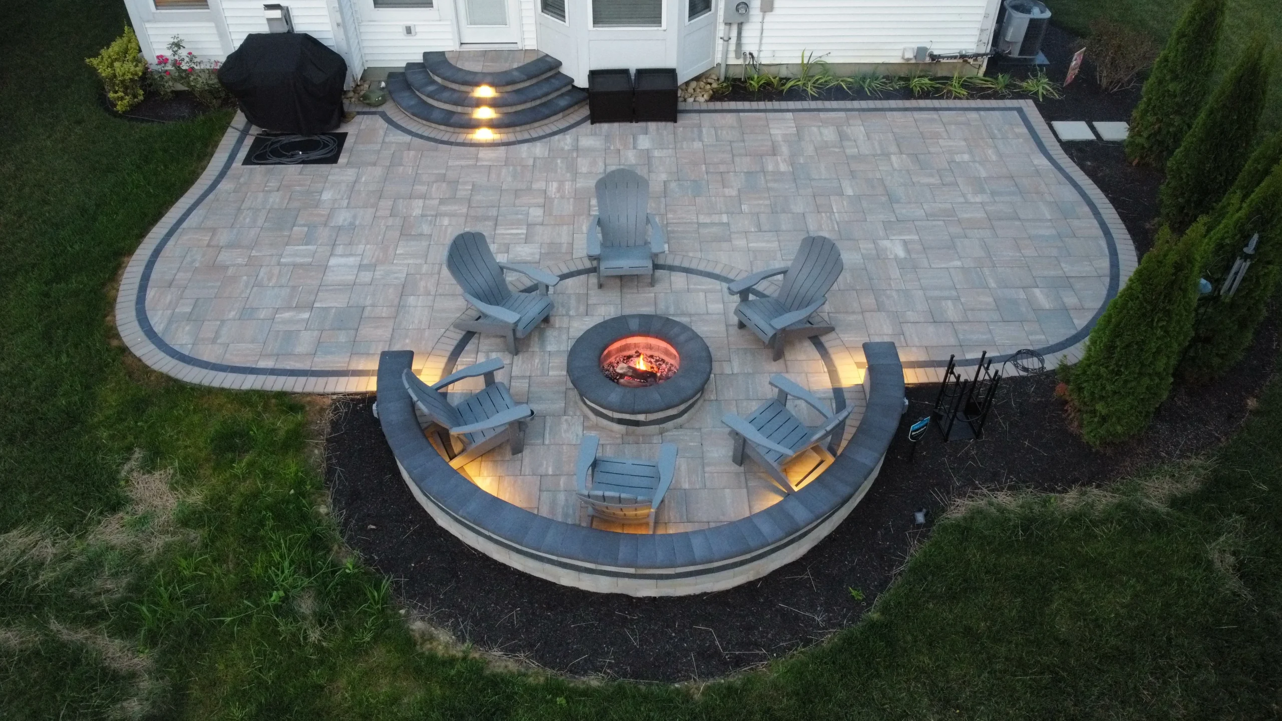 Aerial of a finished Forsyth backyard hardscape with paver patio