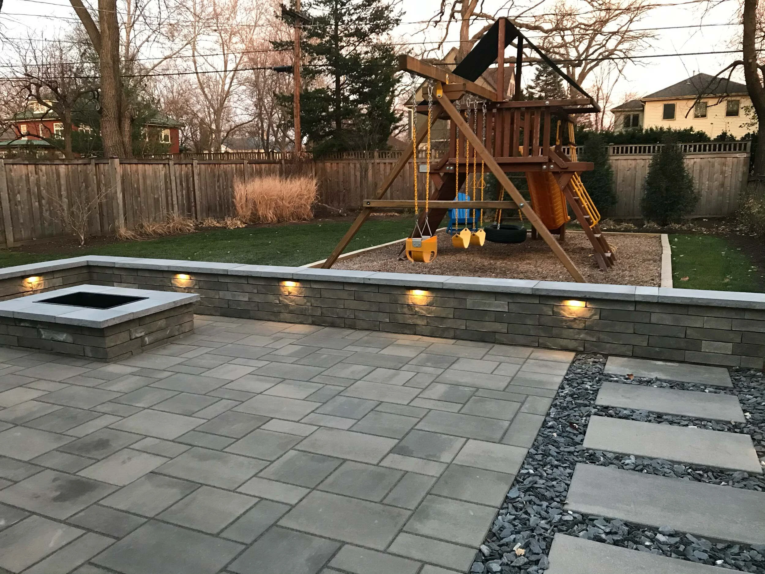 Cumming retaining wall and paver patio install in a luxury subdivision