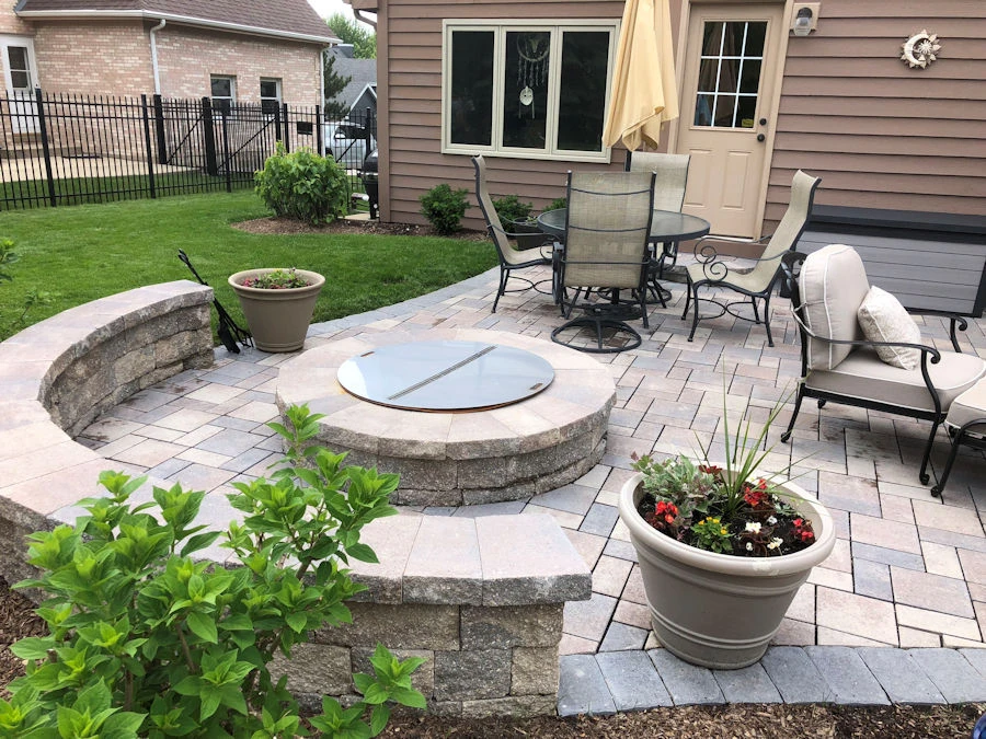 Premium hardscape with custom seat walls in a Johns Creek estate yard