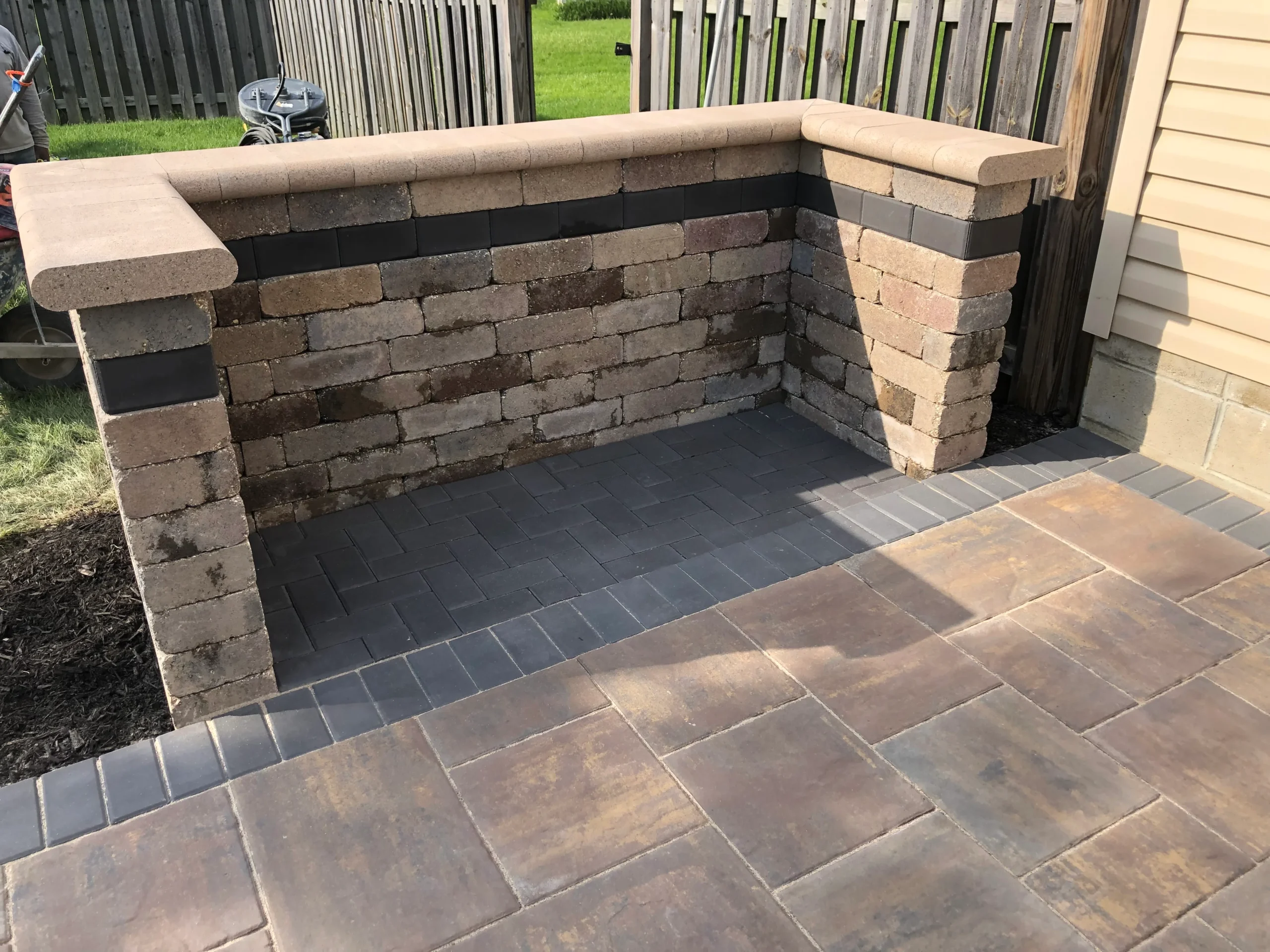 Backyard outdoor living installation with custom hardscape in Johns Creek