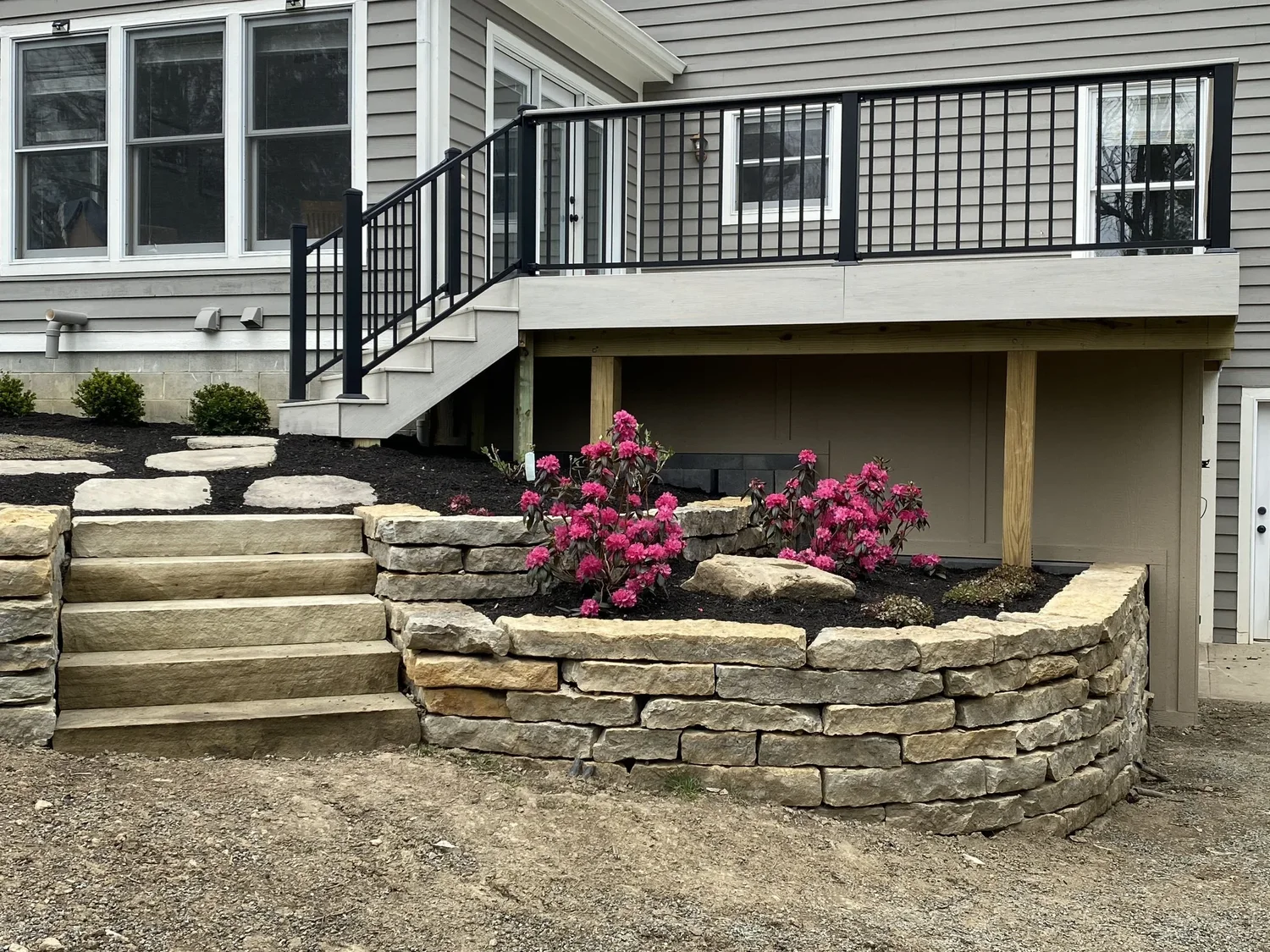 Hardscape construction process with stone wall and paver base in Kennesaw