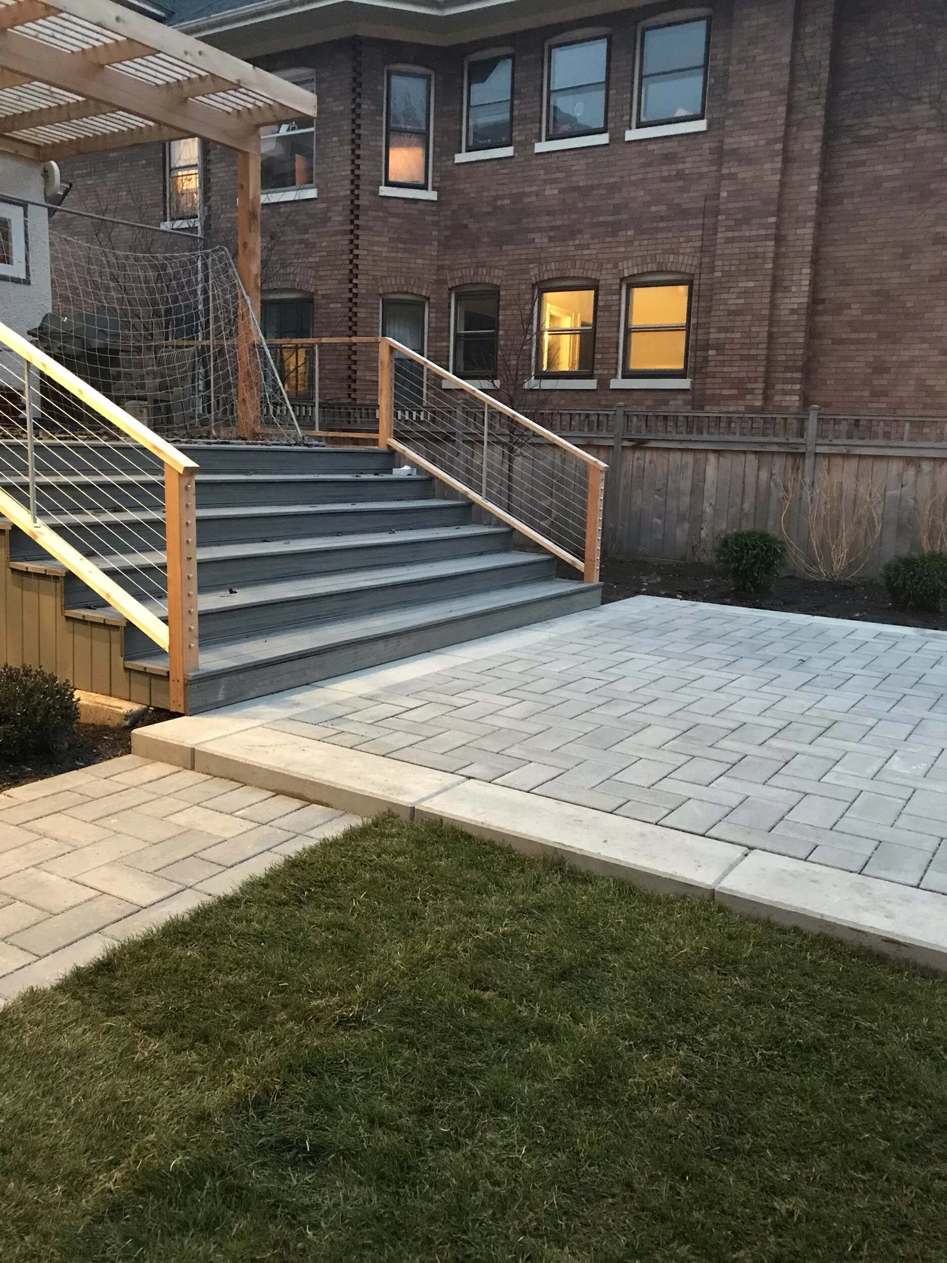 Stone patio with seat wall and outdoor living elements in Kennesaw