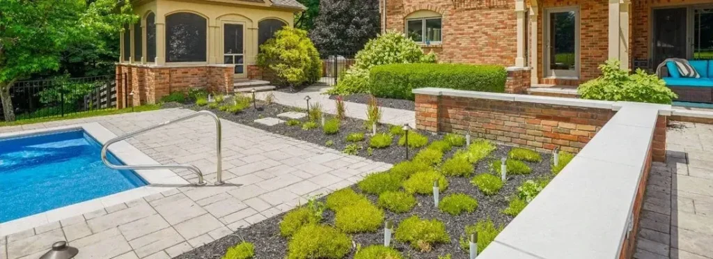 Newly installed retaining wall on a sloped suburban lot - Smyrna, GA hardscaping contractor | Viral Spark Marketing
