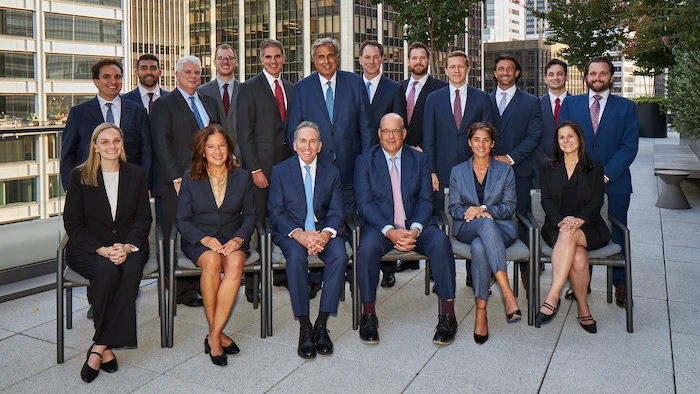 Group portrait of a personal injury law firm team on a rooftop terrace with city skyline - Alpharetta, GA personal injury attorney | Viral Spark Marketing