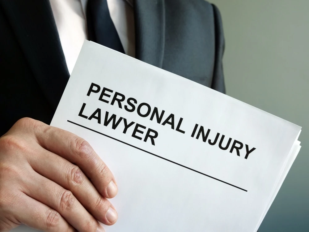 Alpharetta personal injury law firm conference room with attorneys reviewing a case