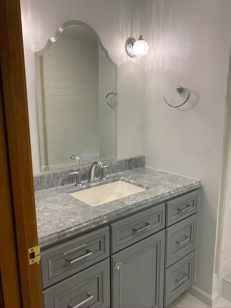 Suwanee bathroom remodel detail showing tile work and lighting