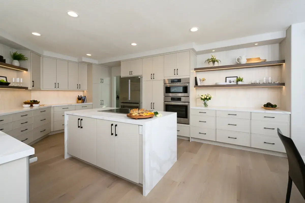 Custom home kitchen and great room integration showing high-end finishes in Suwanee Georgia build