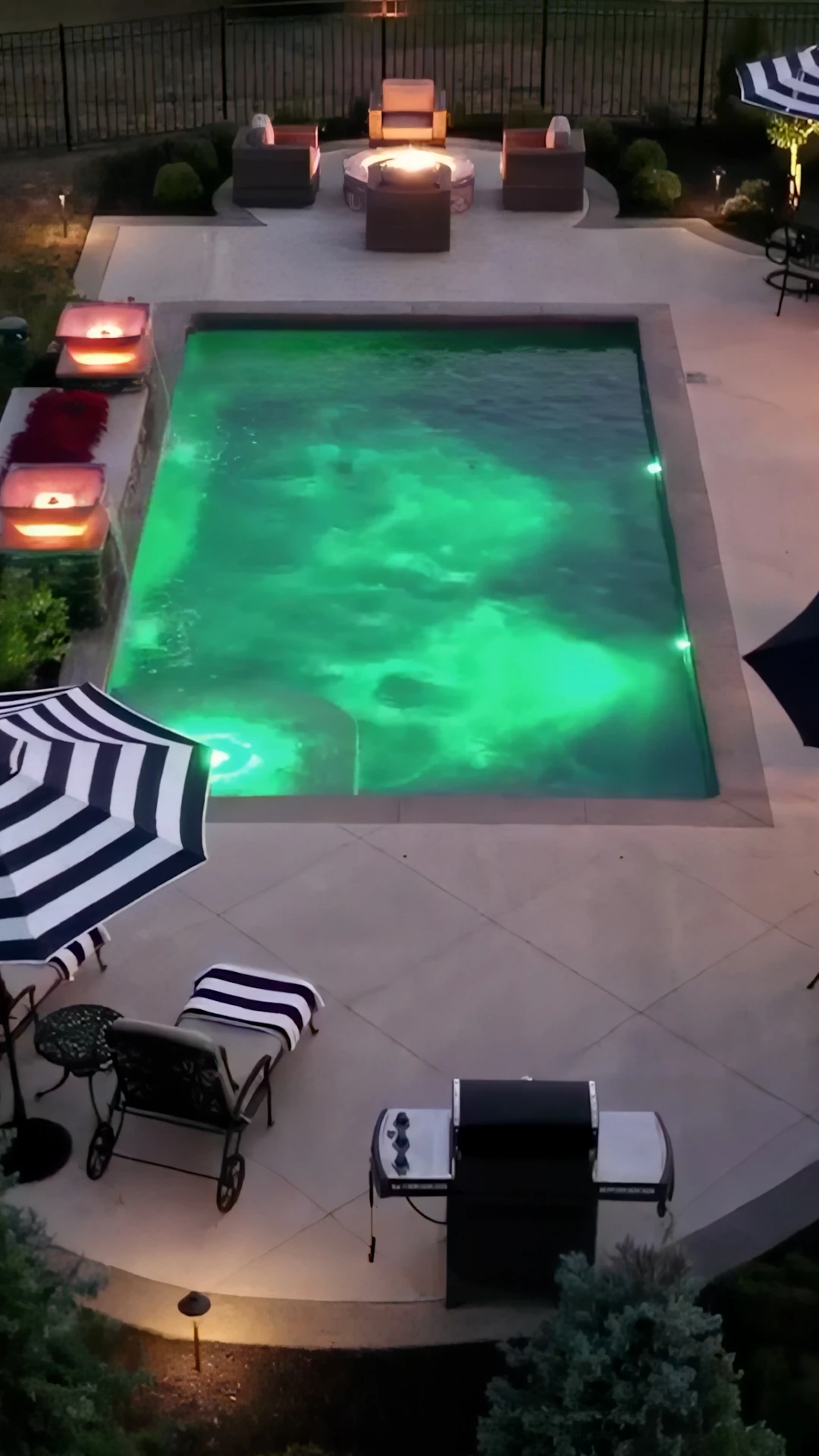 Finished backyard pool with stone deck in Duluth Georgia