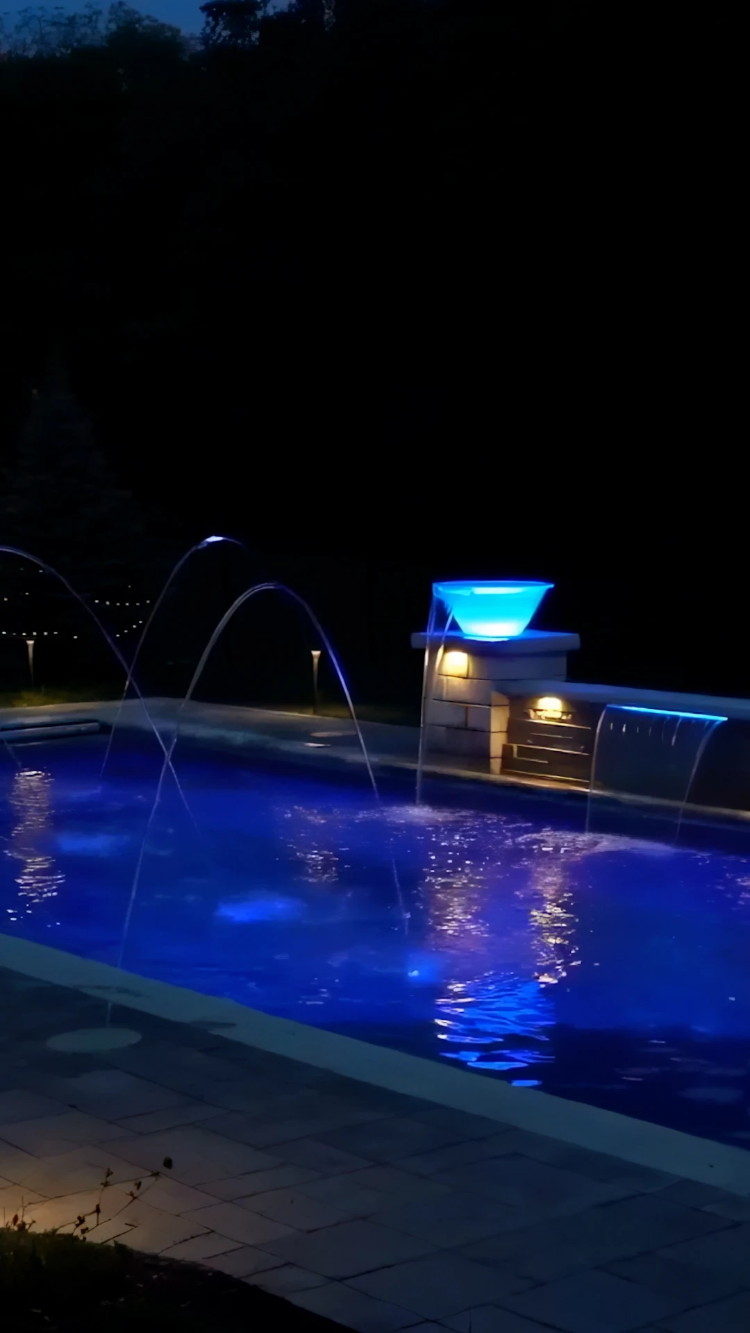 Pool with tanning ledge and stacked stone water feature in Duluth GA