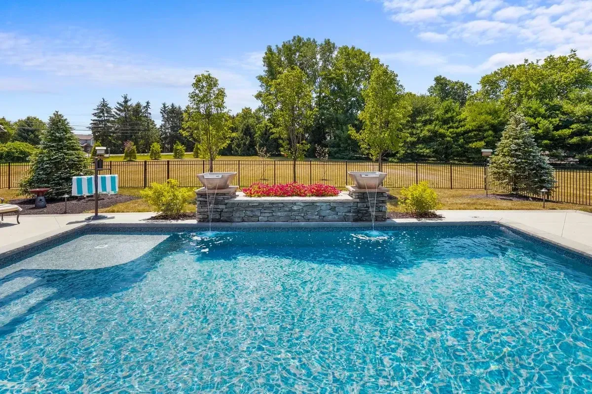 Aerial view of Johns Creek pool build with travertine deck and seating area