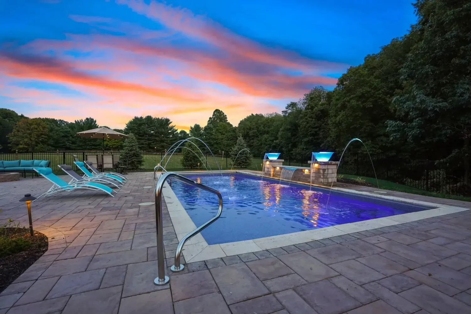 Pool patio with outdoor kitchen and pergola in Suwanee GA