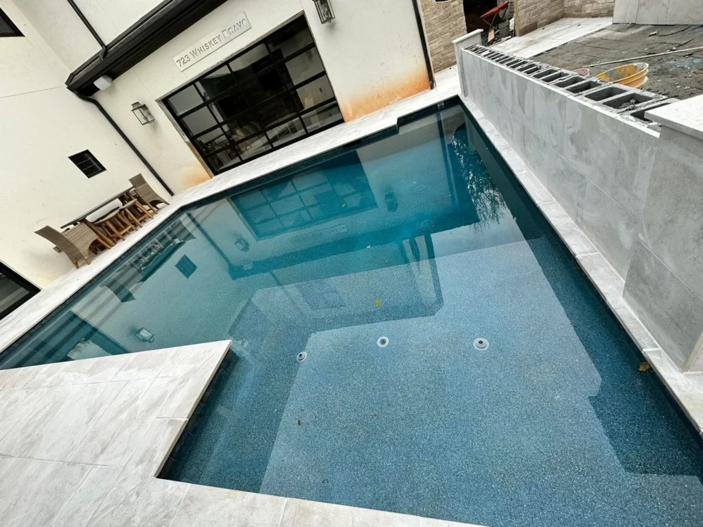 Dipping pool with bench seating and integrated planters - Alpharetta, GA pool builder | Viral Spark Marketing