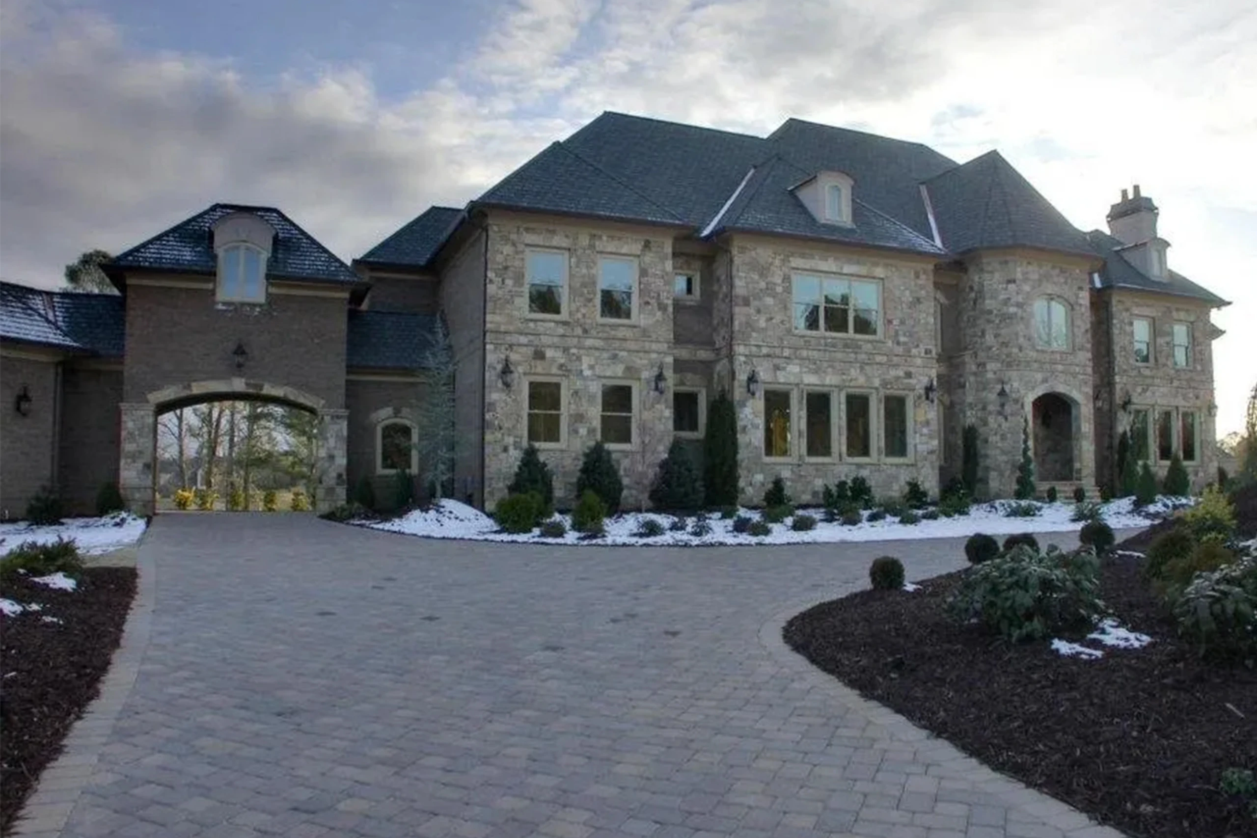 Luxury custom home with twilight lighting in Cumming, Georgia