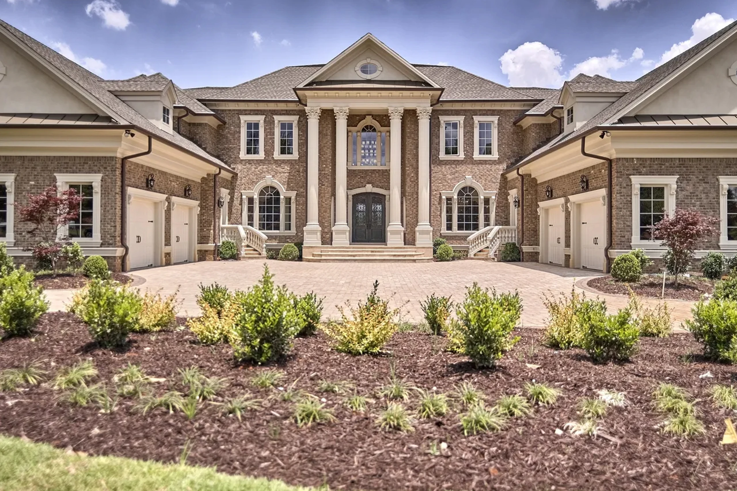 Suwanee custom home detail of stonework and wooden beams