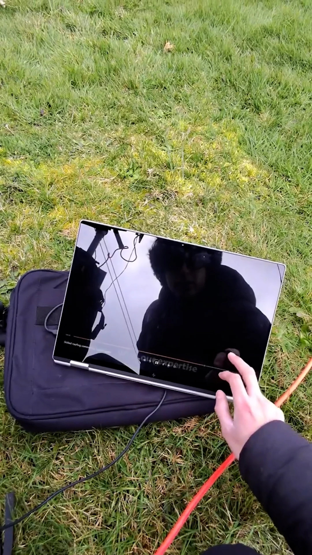 Behind the scenes drone setup and content team at a Cumming roofing shoot
