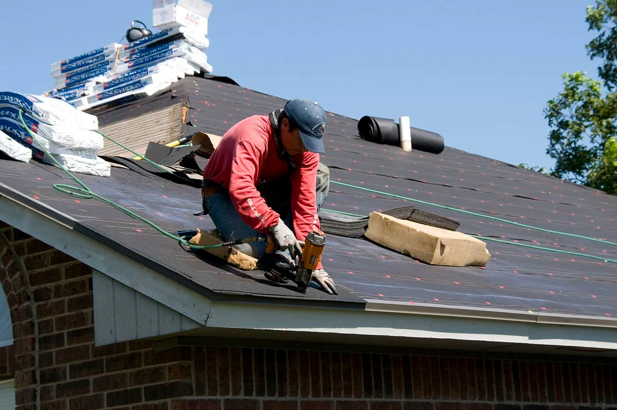 Roofing crew installing flashing on a Buford home near Reunion