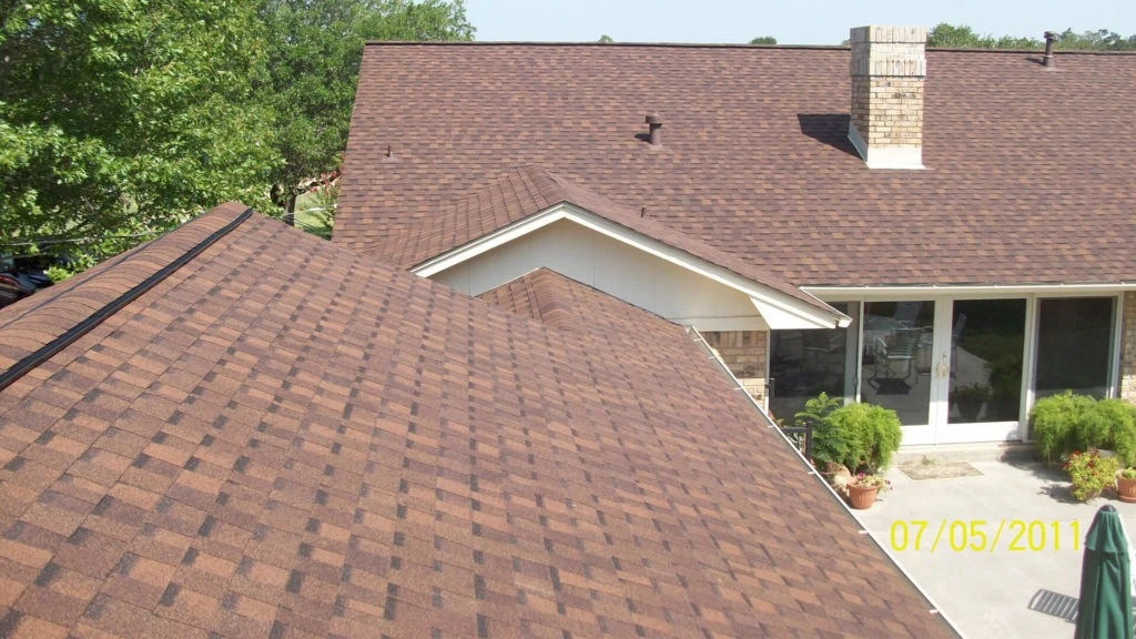 Buford roofing crew on the roof of a Legacy Springs home with detailed flashing work