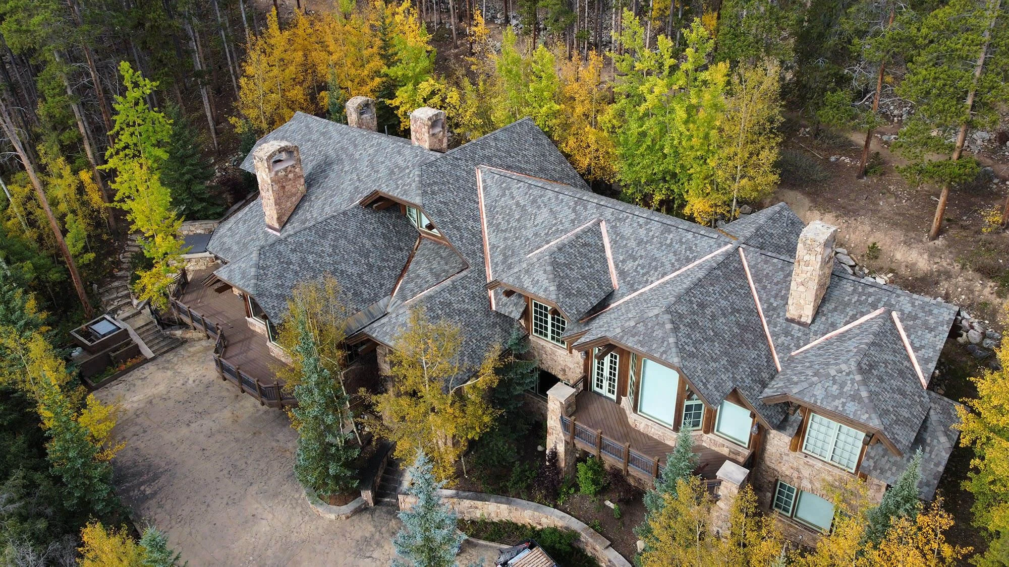 Roofer reviewing storm damage with a Cumming homeowner
