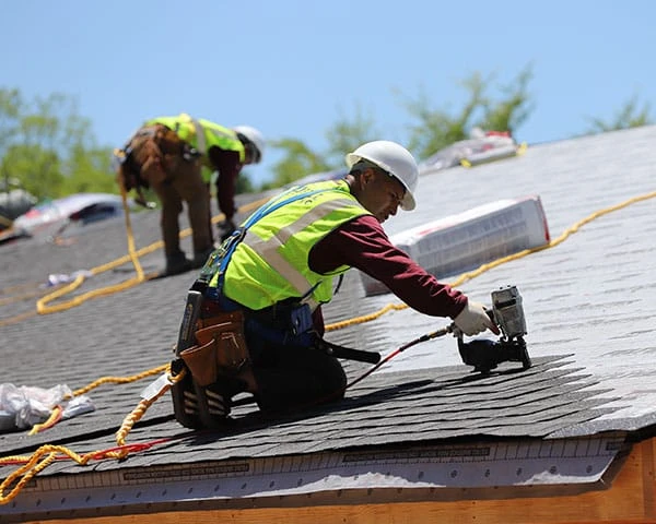 Kennesaw roofing contractor crew on active job site completing full shingle replacement near Wade Green Road