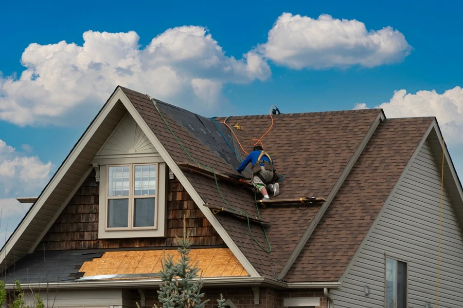 Marietta roofing contractor working with shingles on a residential roof