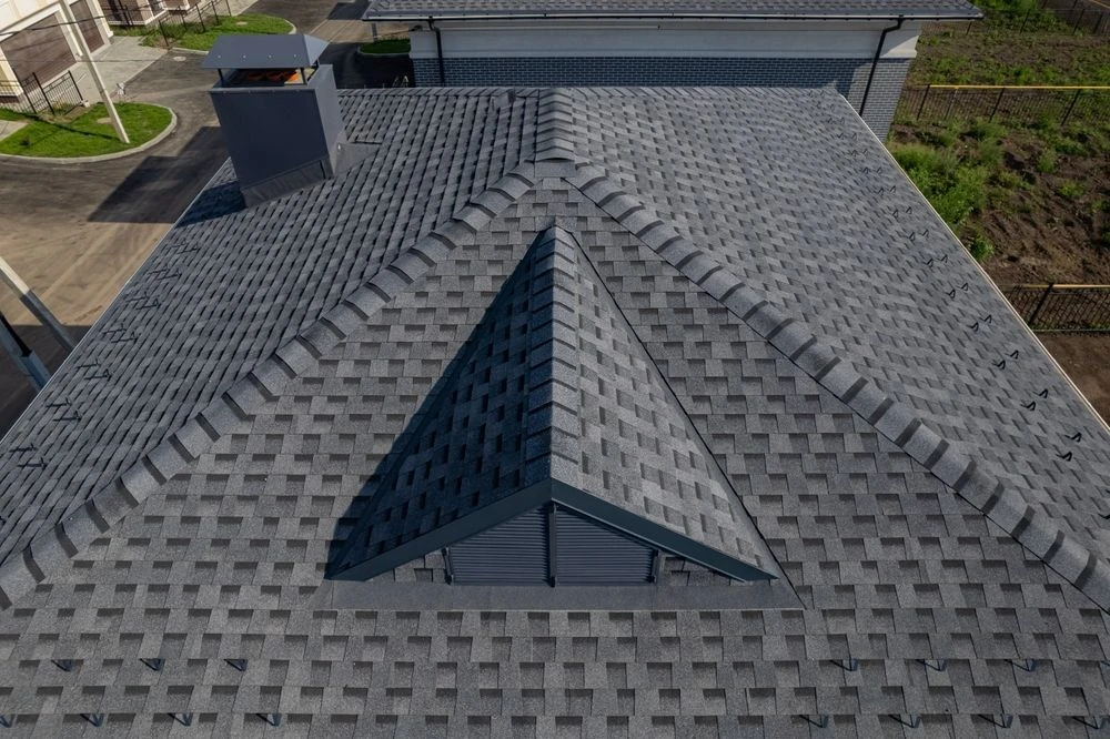 Aerial drone view of a Smyrna roofing project at sunset