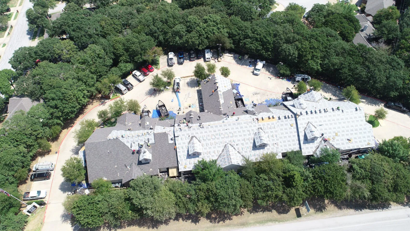 Suwanee roofer carrying shingles to a residential roof